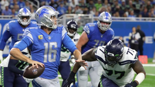 Seattle Seahawks defensive tackle Quinton Jefferson (77) rushes Detroit Lions quarterback Jared Goff (16) during the first half at Ford Field, Oct. 2, 2022.